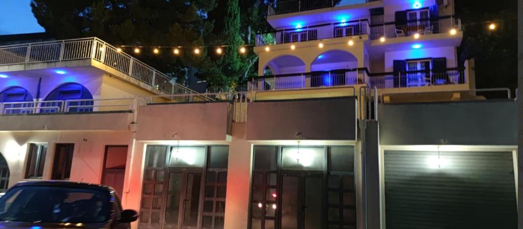 a building with blue lights on top of it at Apartments Nautilus in Ulcinj