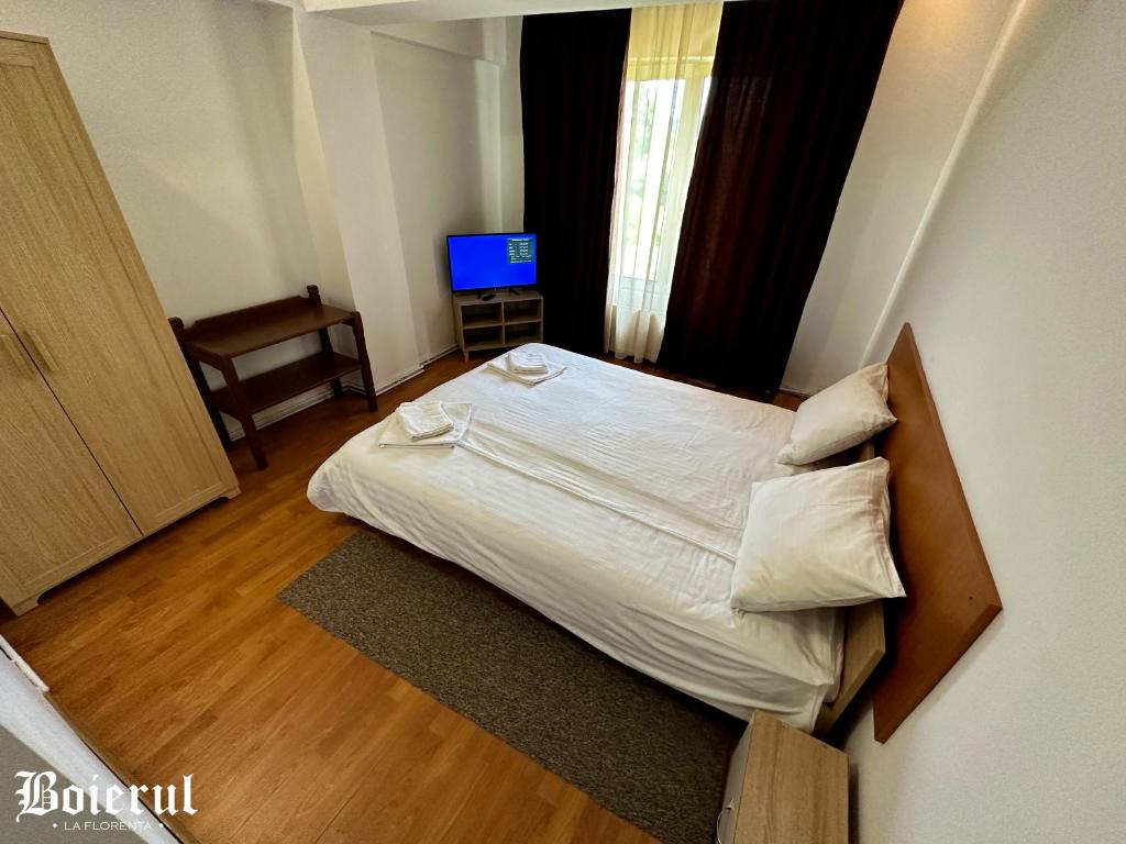 Postel nebo postele na pokoji v ubytování Boierul la Florenta