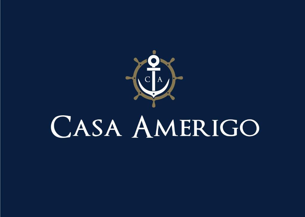 un logo pour une entreprise avec ancre et bateau dans l'établissement Casa Amerigo, à Morro de São Paulo