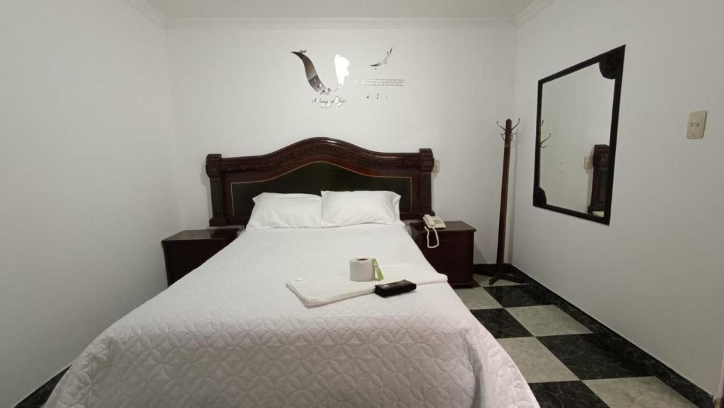 Llit o llits en una habitació de Hotel Nuevo Horizonte E.M.J