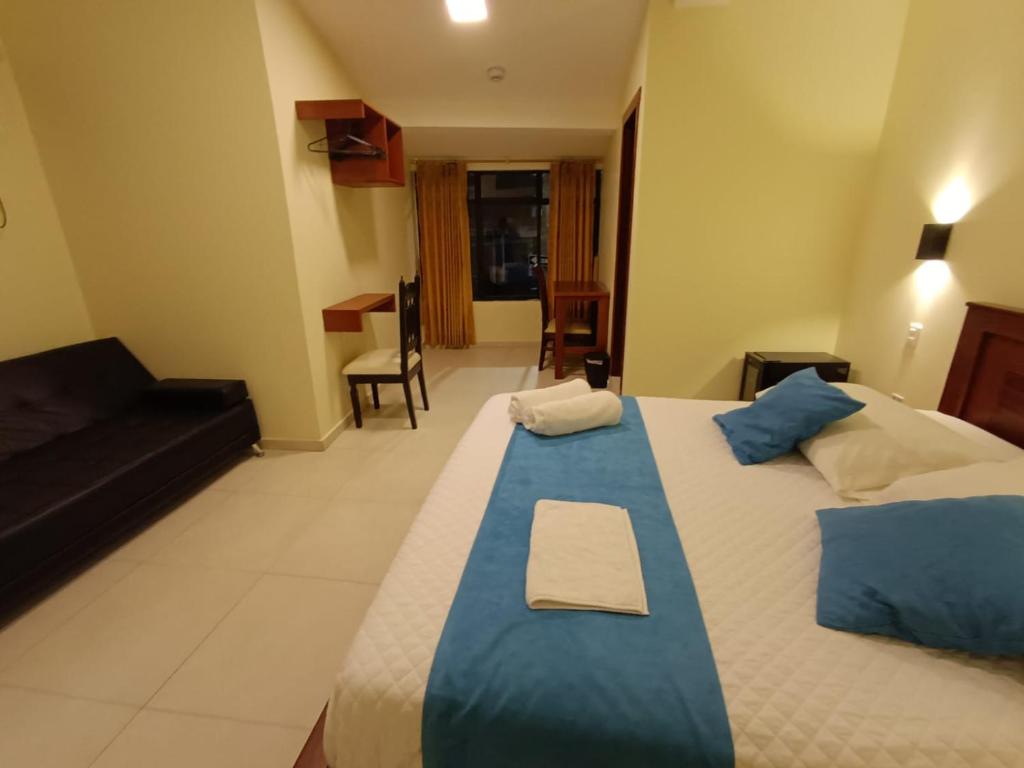 Postel nebo postele na pokoji v ubytování Hostal CañaLimeña
