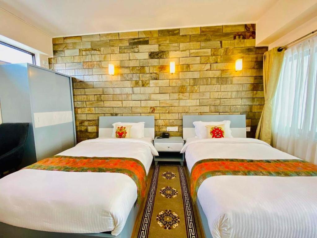 Postel nebo postele na pokoji v ubytování Pata Inn