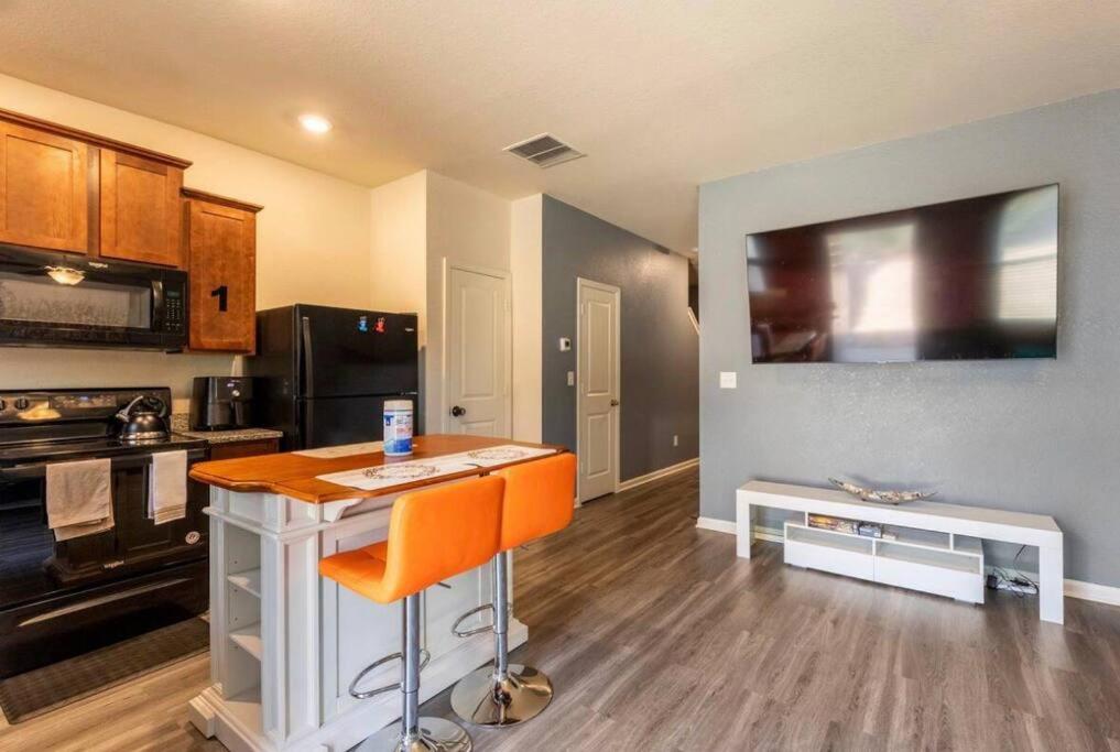 a kitchen with an island in the middle of a room at Modern Retreat near Hartsfield-Jackson Airport in Atlanta