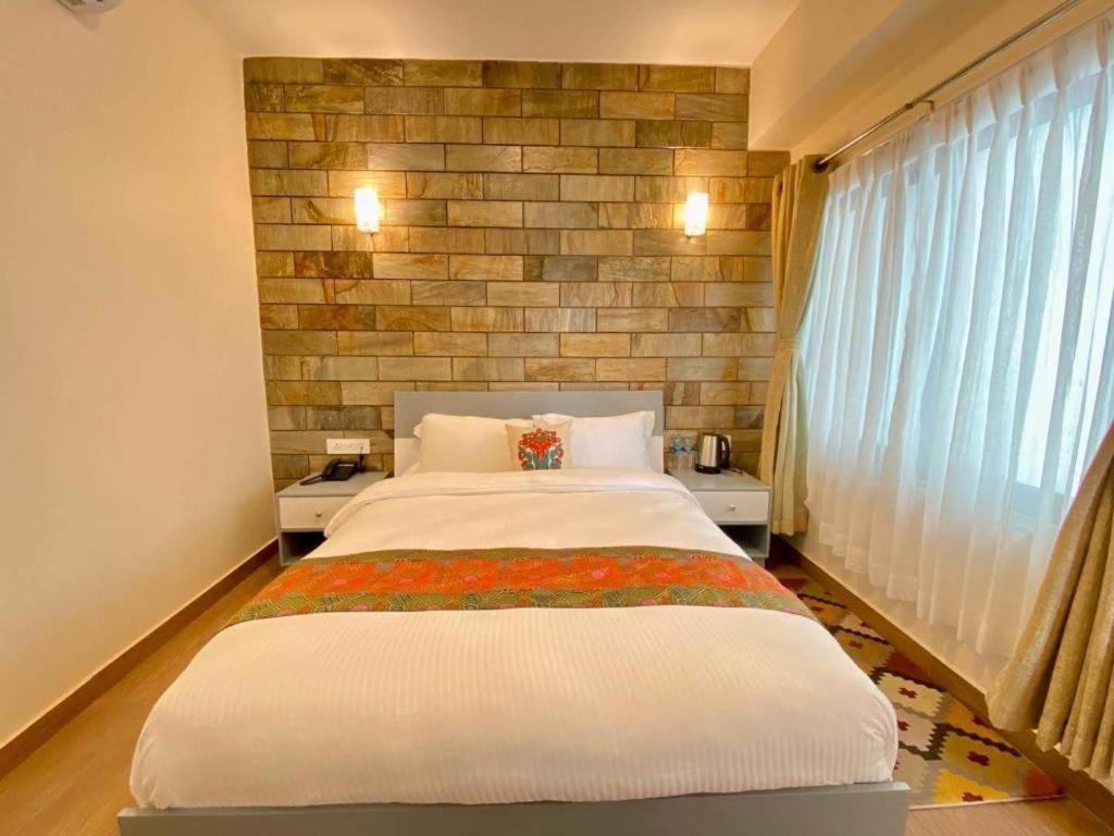 Postel nebo postele na pokoji v ubytování Pata Inn
