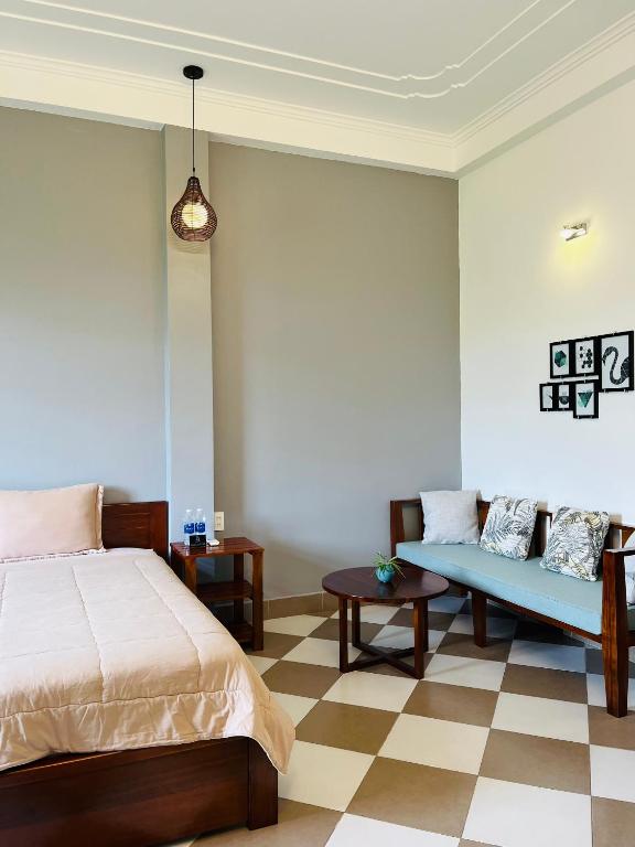 Postel nebo postele na pokoji v ubytování Queenie House