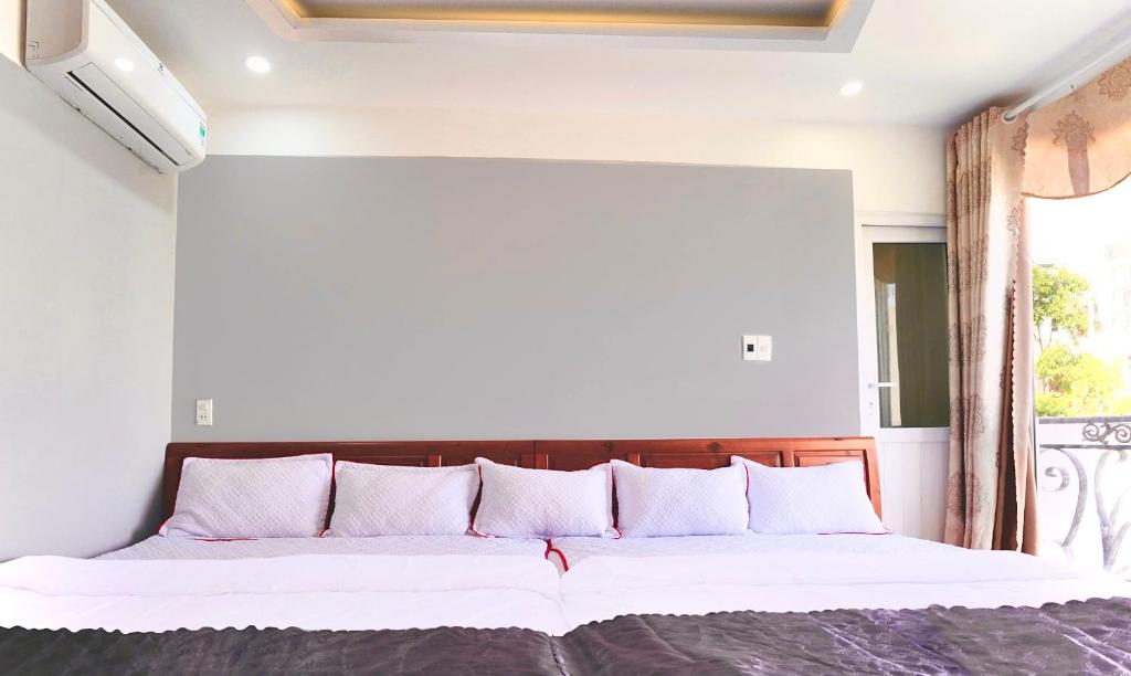 Voodi või voodid majutusasutuse Hotel Hoàng Thịnh toas