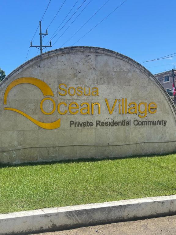 a sign for the sosua ocean village phosphatereservationurrency at DesSea Island-Sosua Ocean Village in Sosúa