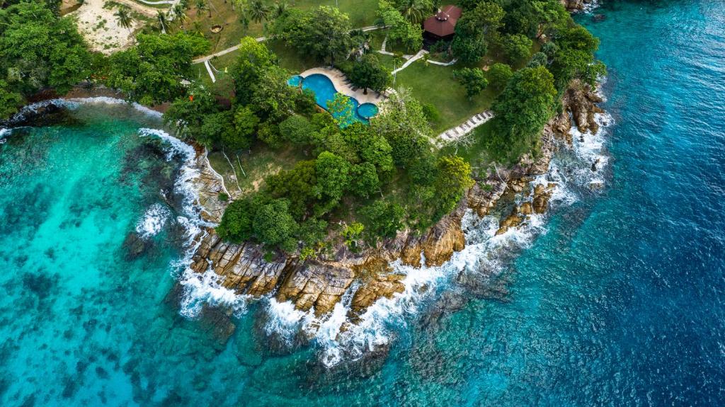 an aerial view of a small island in the ocean at Ban Raya Resort and Spa in Ko Racha Yai