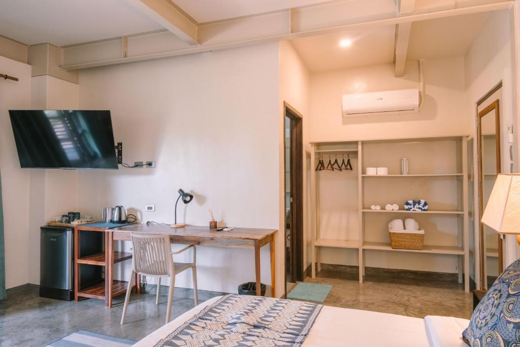 TV a/nebo společenská místnost v ubytování Kaimana Resort Siargao