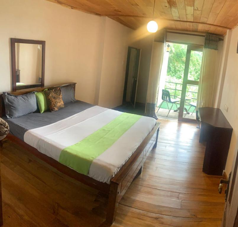 Postel nebo postele na pokoji v ubytování Golden King Guest