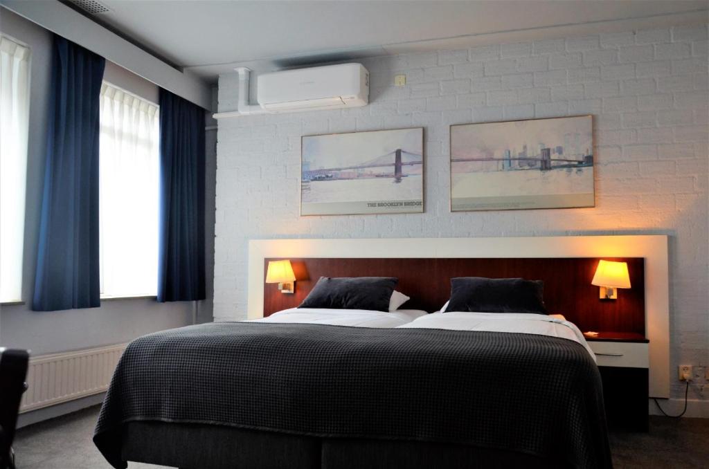 Postel nebo postele na pokoji v ubytování Apollo Hotel