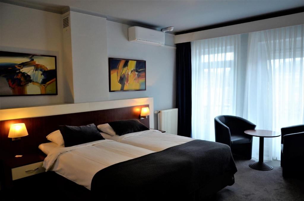 Postel nebo postele na pokoji v ubytování Apollo Hotel