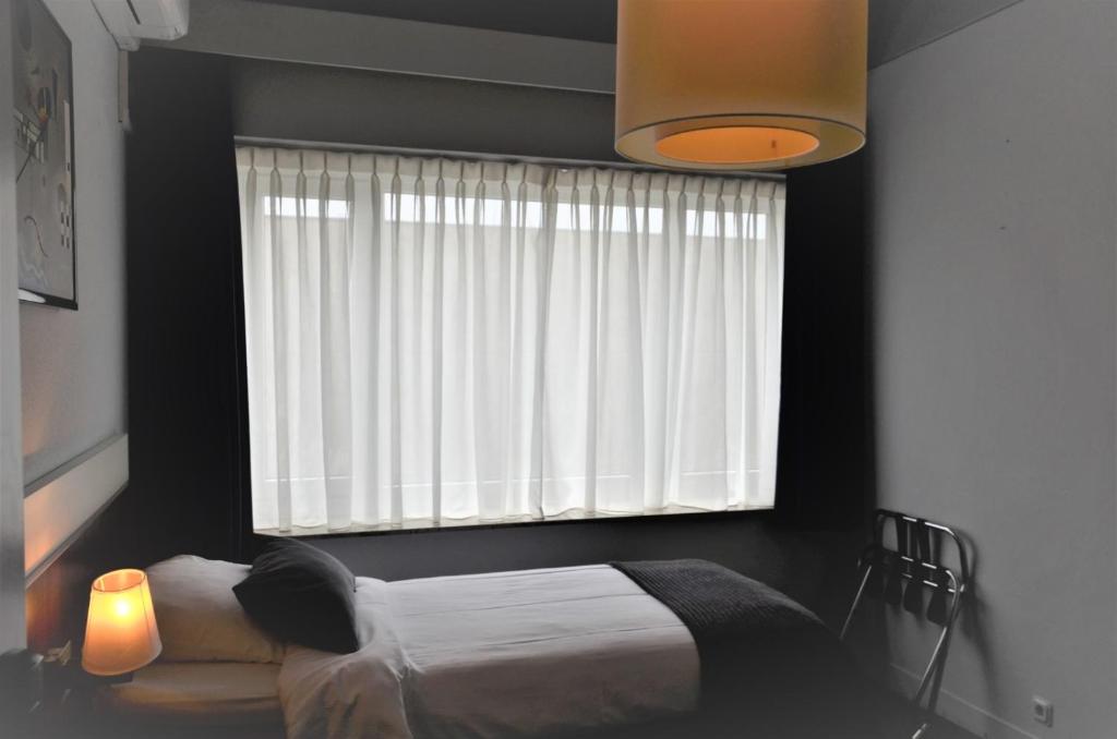 Postel nebo postele na pokoji v ubytování Apollo Hotel