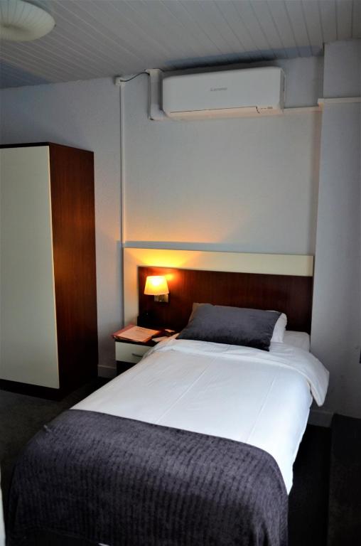 Postel nebo postele na pokoji v ubytování Apollo Hotel