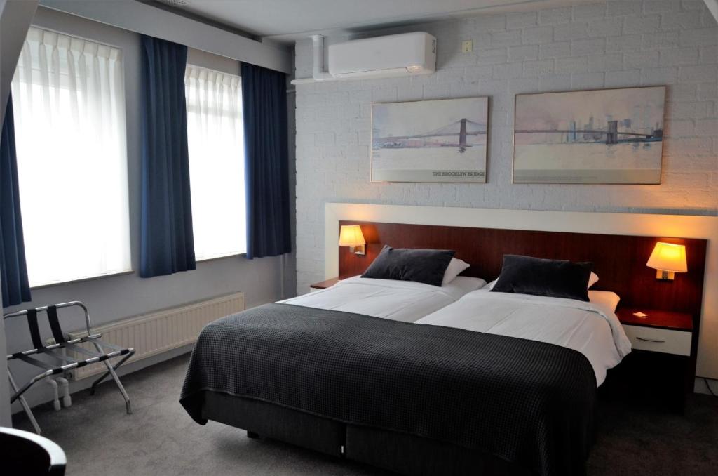 Postel nebo postele na pokoji v ubytování Apollo Hotel