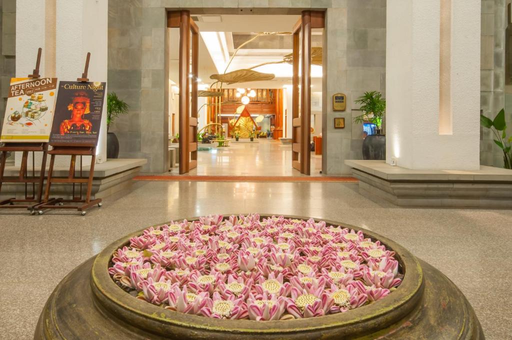 a large pool of pink flowers in a lobby at Borei Angkor Resort & Spa in Siem Reap