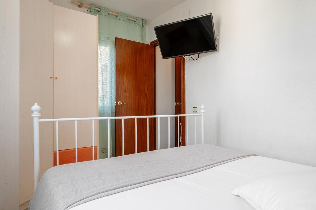 Postel nebo postele na pokoji v ubytování Atico Duplex Pepe y Rosi