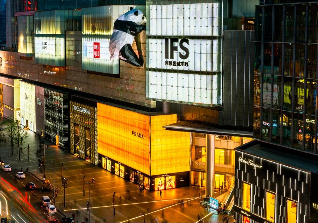 a view of a building in a city at night at Crowne Plaza Chengdu City Center by IHG in Chengdu
