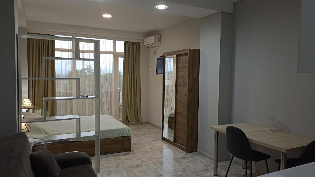 Ένα ή περισσότερα κρεβάτια σε δωμάτιο στο Apartment Zhemchuzhina Ureki-5 СТУДИО