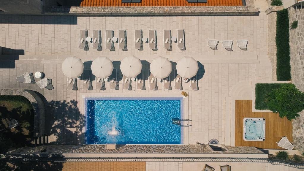 an overhead view of a building with a swimming pool at Palace Natali in Dubrovnik