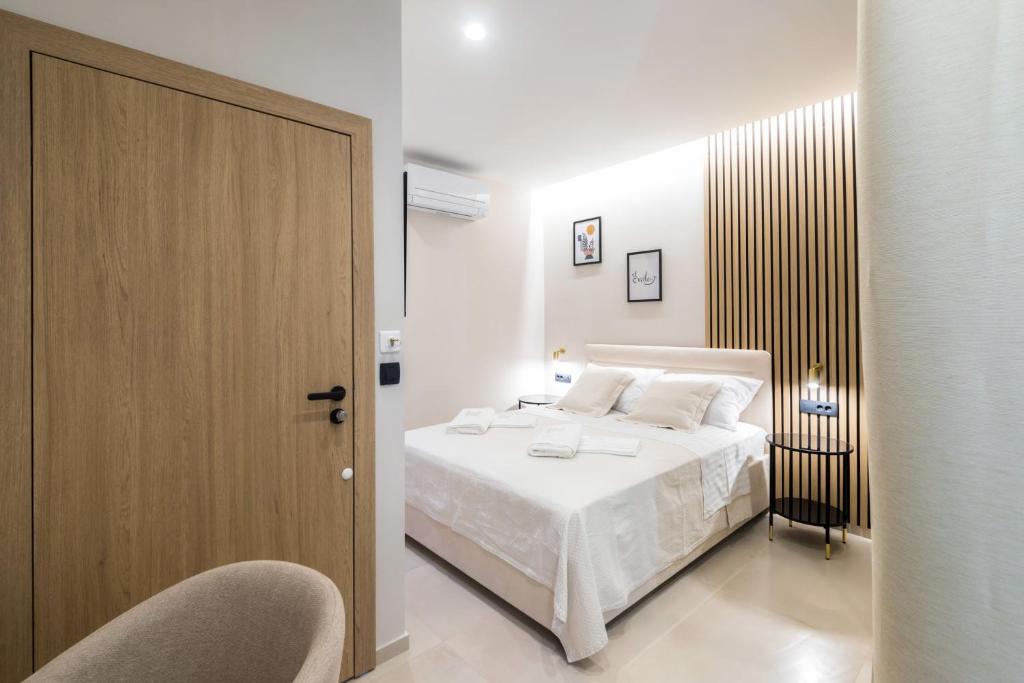 Postel nebo postele na pokoji v ubytování Tonio Rooms