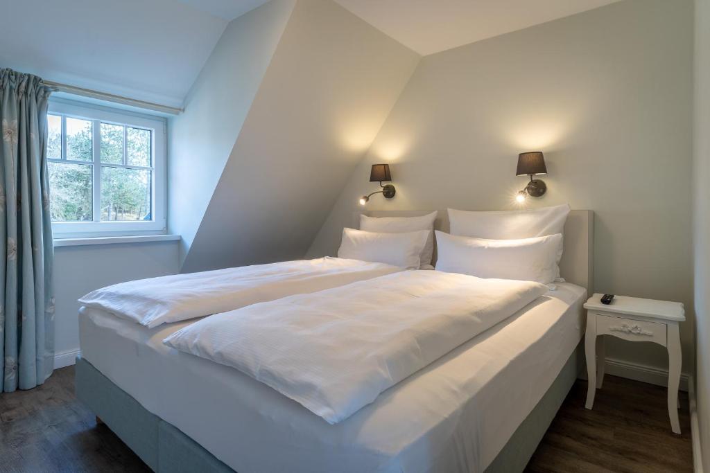 Postel nebo postele na pokoji v ubytování Hotel TWEED