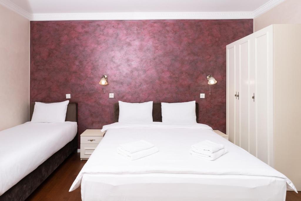 Postel nebo postele na pokoji v ubytování Ornament Hotel