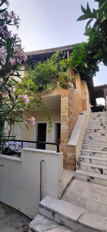 a building with stairs and plants on the side of it at 250m to the Beach - Fully Furnished - Fast Wi-Fi in Marmaris