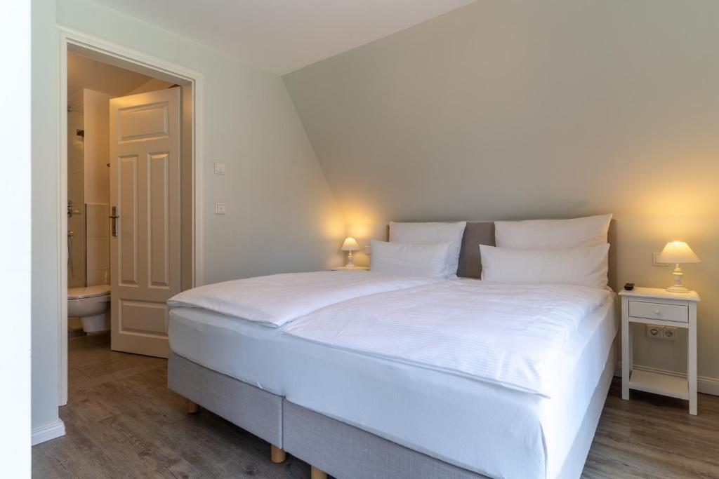 Postel nebo postele na pokoji v ubytování Hotel TWEED