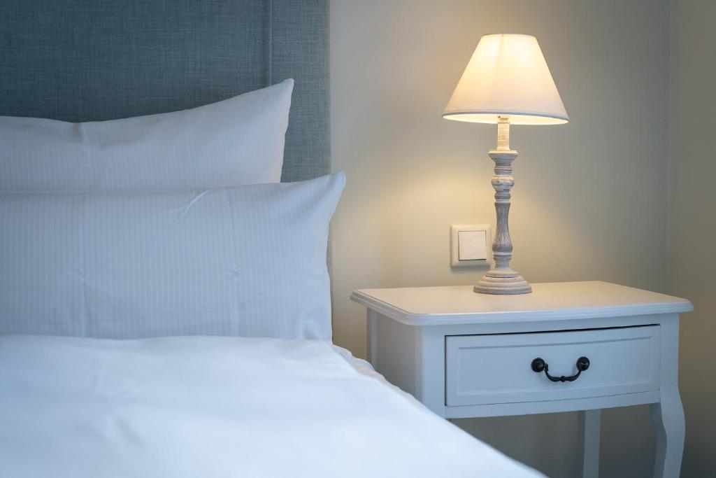 Postel nebo postele na pokoji v ubytování Hotel TWEED