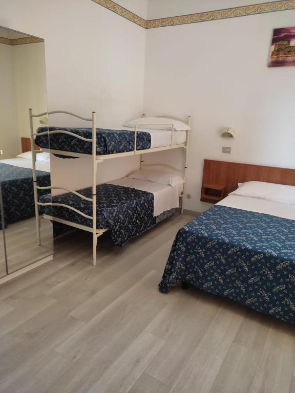 Postel nebo postele na pokoji v ubytování Hotel Sissi