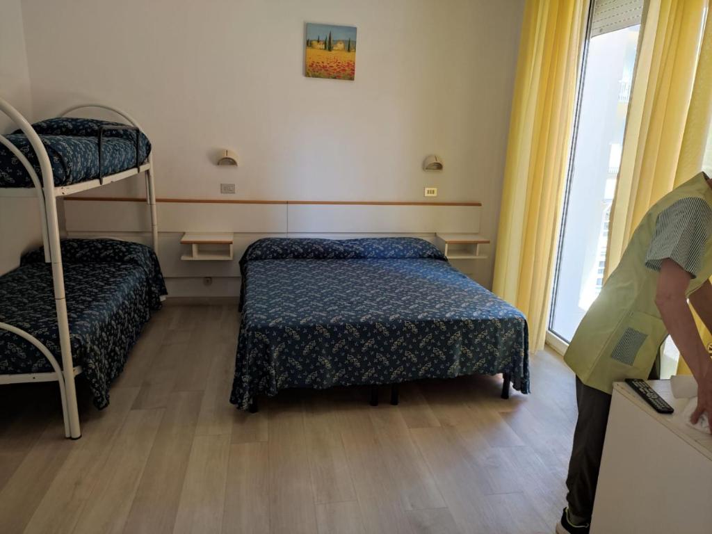 Postel nebo postele na pokoji v ubytování Hotel Sissi