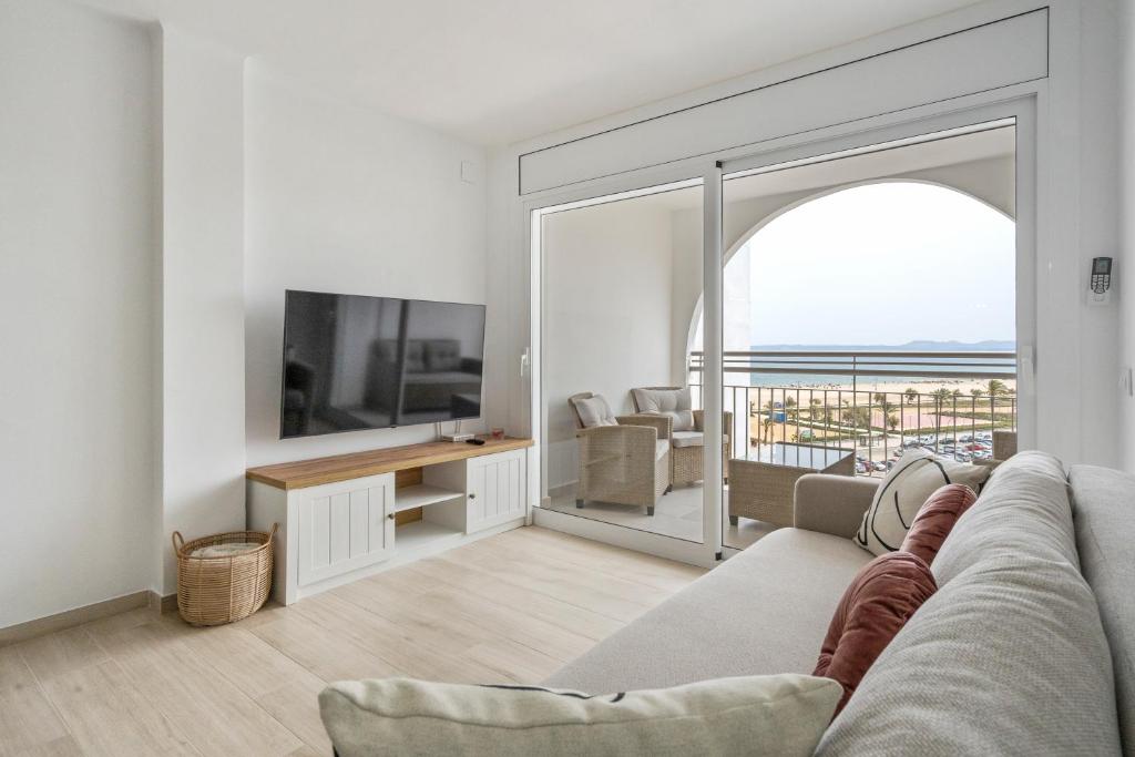 Televízia a/alebo spoločenská miestnosť v ubytovaní WELCS APARTAMENTO 064 EMP frente al Mar
