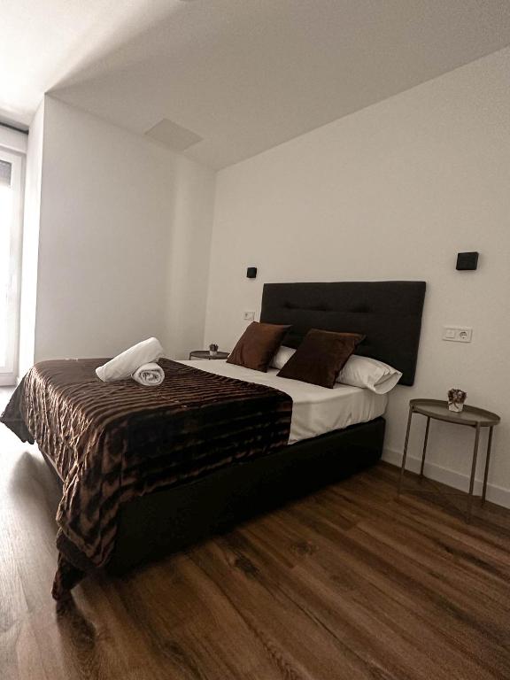 Postel nebo postele na pokoji v ubytování Hostal Arenal Madrid