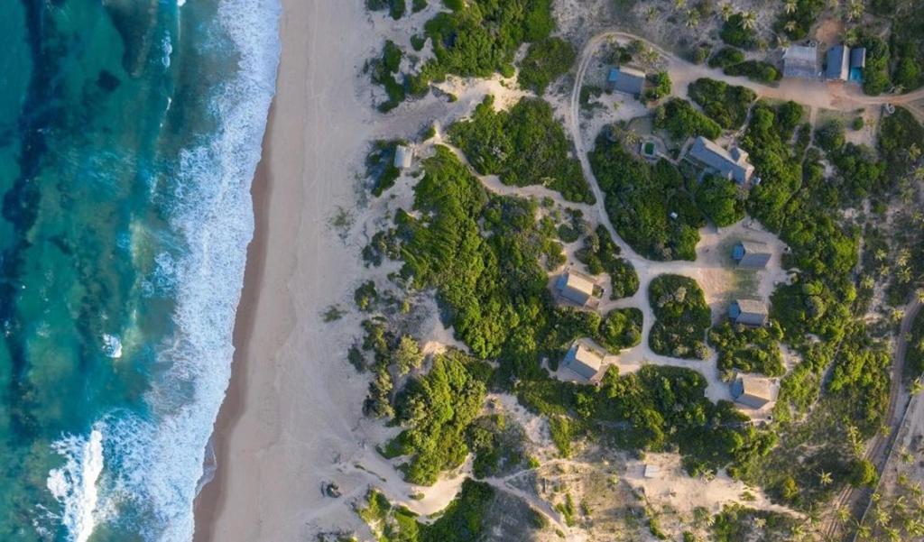 an aerial view of the beach and the ocean at Singila Ocean Lodge in Inhambane