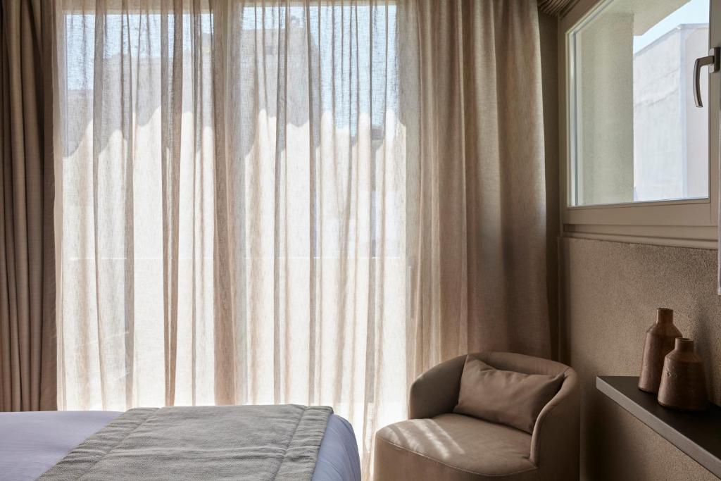 Letto o letti in una camera di Alaso Design Suites