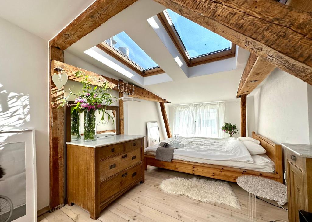 a bedroom with a bed and a skylight at Sopot Apartment 54 in Sopot