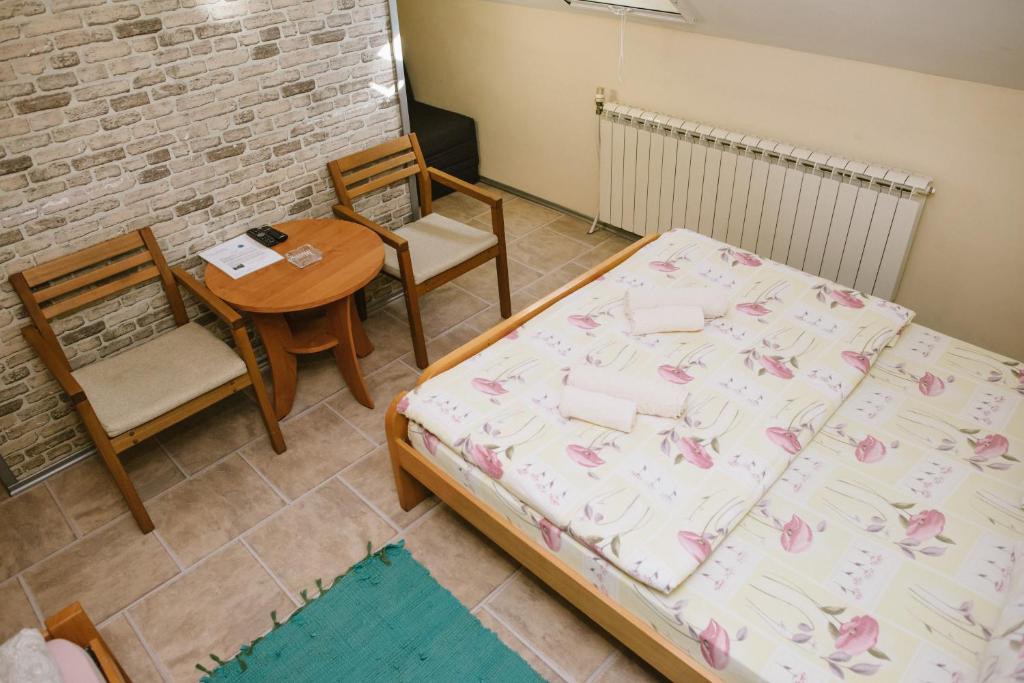 Postel nebo postele na pokoji v ubytování Sobe Tatjana