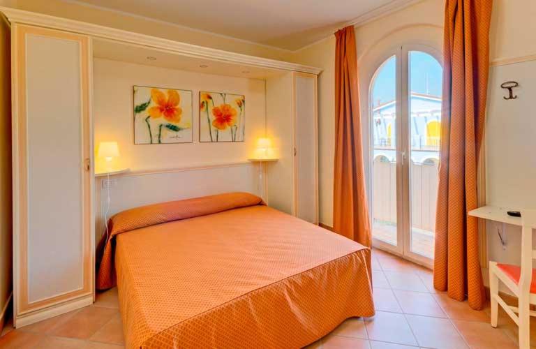 Postel nebo postele na pokoji v ubytování La Piazzetta Affittacamere B&B