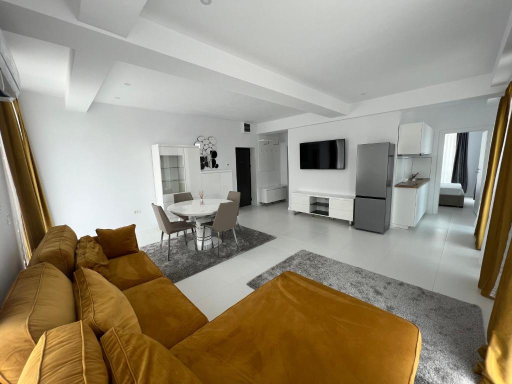 a living room with a couch and a table at Oxygen Residence Neptun in Neptun