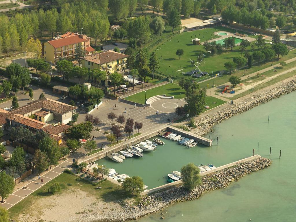 an aerial view of a marina with boats in the water at Hotel Campanello in Castelnuovo del Garda