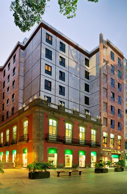 a large building with green lights in front of it at Hotel Principe Paz in Santa Cruz de Tenerife