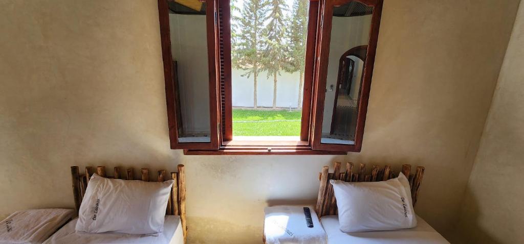 Postel nebo postele na pokoji v ubytování Auberge Dar Laazouzi