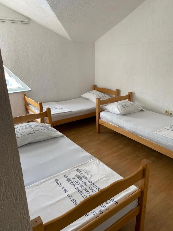 Postel nebo postele na pokoji v ubytování Hostel Heimli