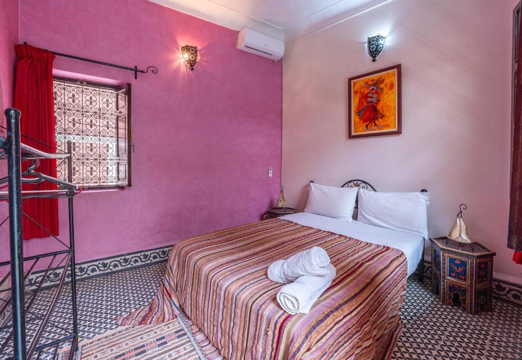 Postel nebo postele na pokoji v ubytování Riad Todra