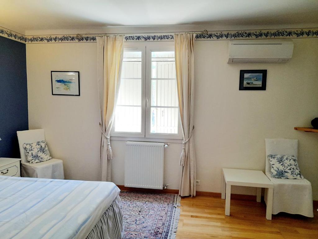 Postel nebo postele na pokoji v ubytování Domaine Des Écureuils