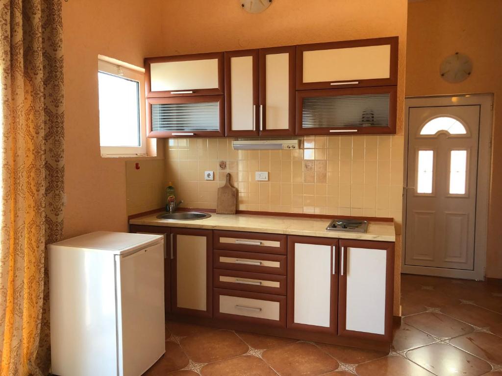 Kuchyň nebo kuchyňský kout v ubytování Apartments Delcheva