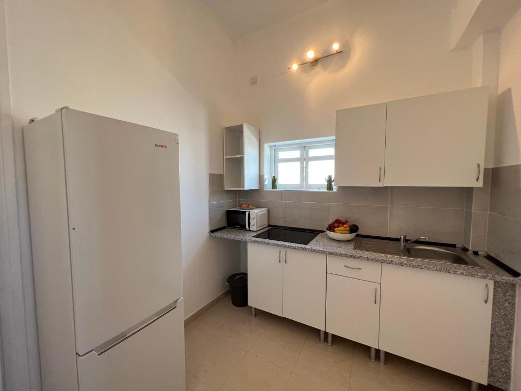 Kuchyň nebo kuchyňský kout v ubytování CoLiving Villa Brasil
