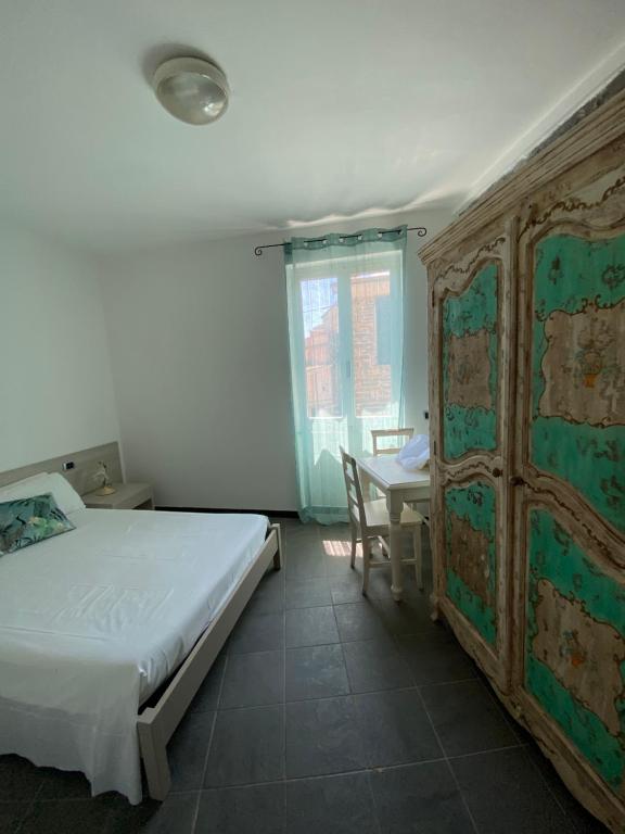 Cama o camas de una habitación en Pensione Sorriso