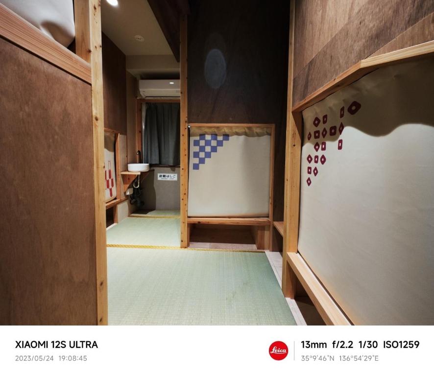 Postel nebo postele na pokoji v ubytování Sakae Guesthouse